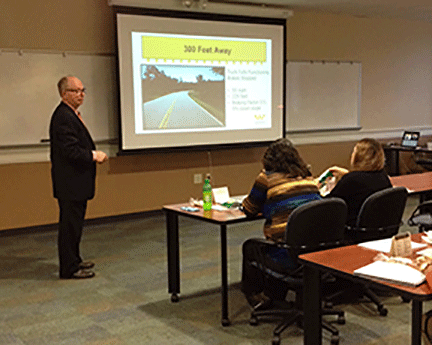 Dan Olson presenting his Collision Course to a local insurance group.
