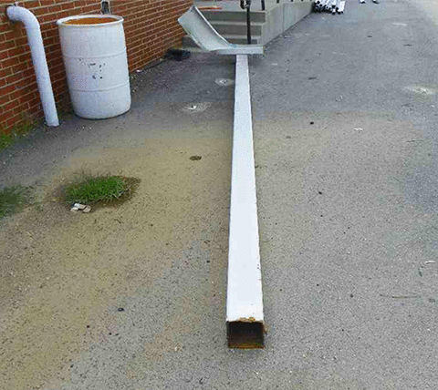 Figure 1: A view of a tornado-damaged steel column cut down at ground level with a band saw.
