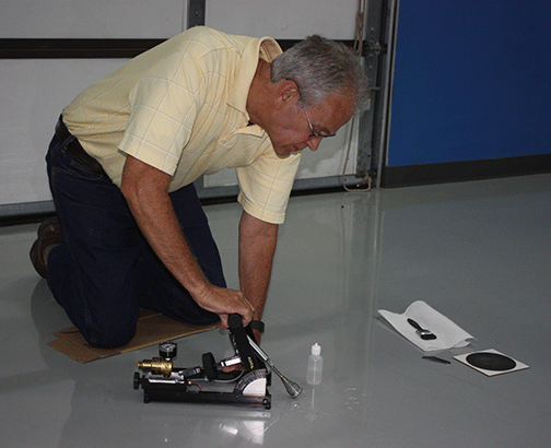 Steve Hunt using an Excel Tribometer measuring a floor surface.