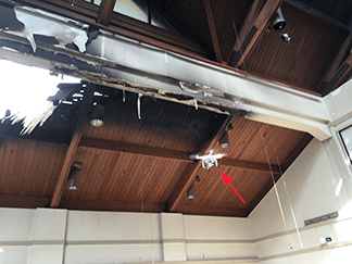 Figure 4. Drone inside fire damaged building inspecting hard to access roof beams.